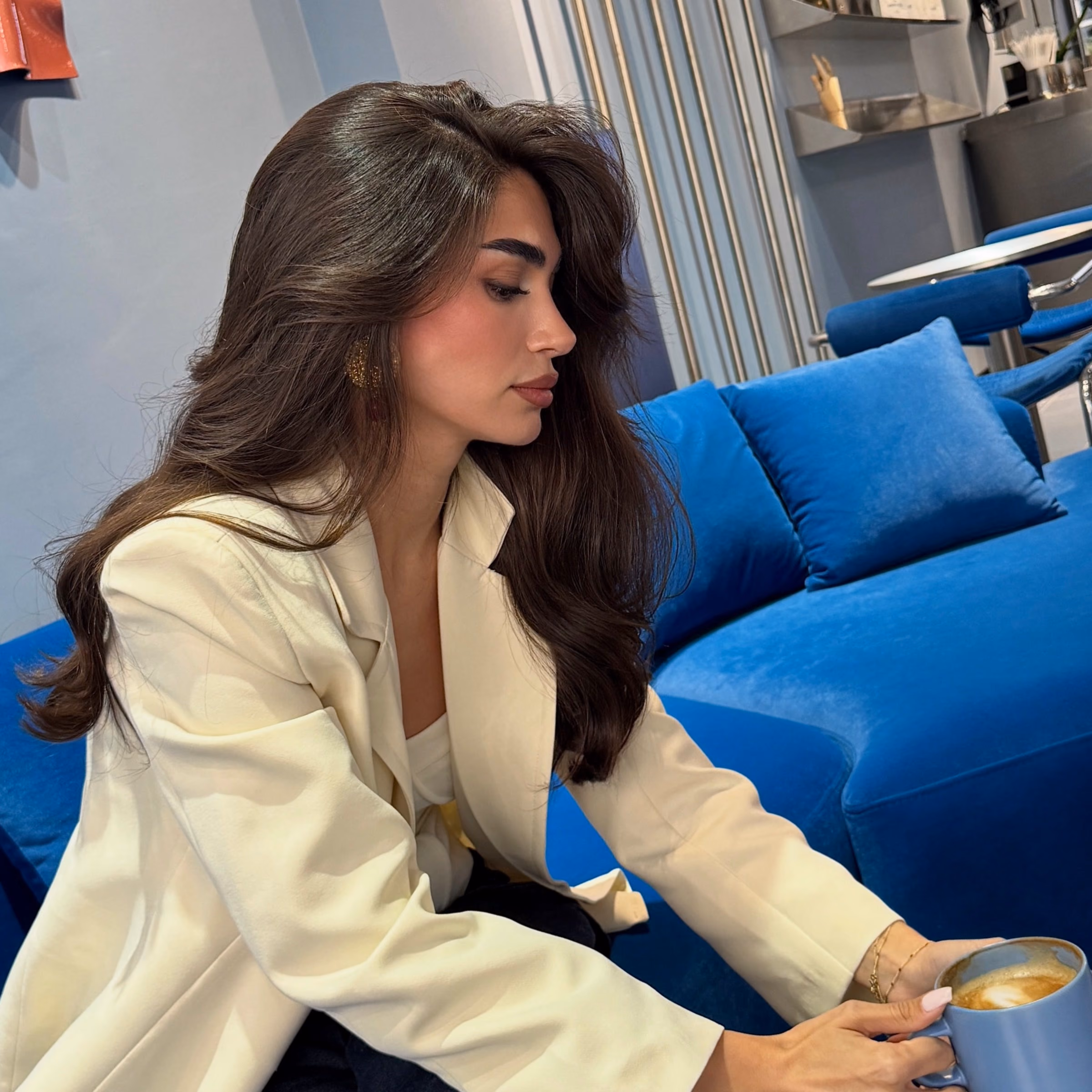 Patient in a cream blazer after rhinoplasty in Ankara, side profile